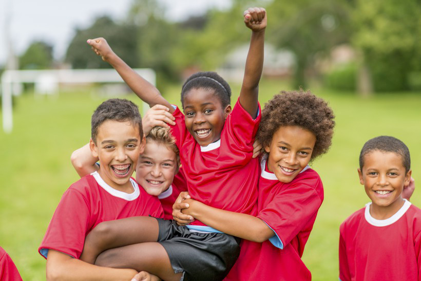 Happy school children hugging!